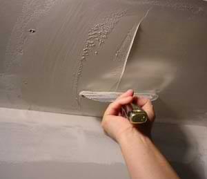photo of skim coating a drywall ceiling patch