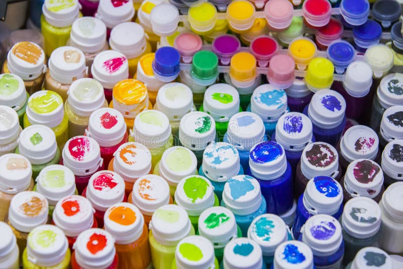 Acrylic, gouache paints, top view, paints in jars of all colors of the rainbow stock photography