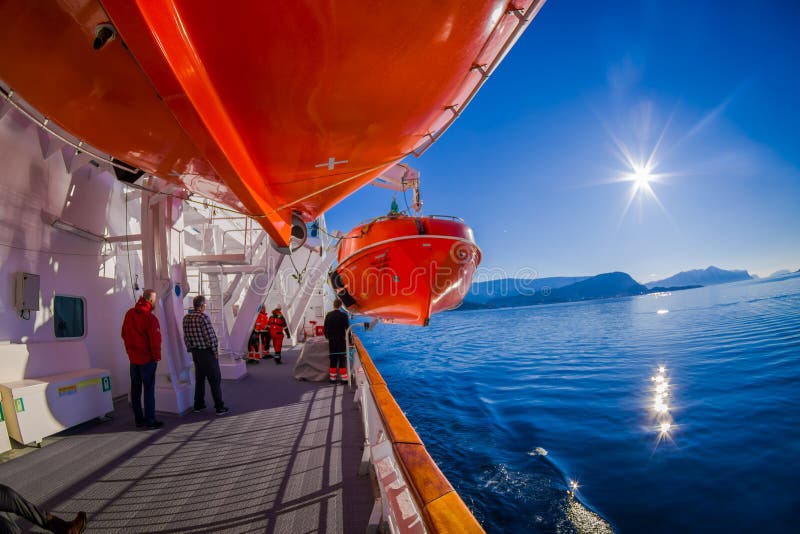 ALESUND, NORWAY - APRIL 04, 2018: Life boats on board of the MS Trollfjord, operated by the Norwegian shipping company. Hurtigruten, in Hurtigruten in Norway stock photography