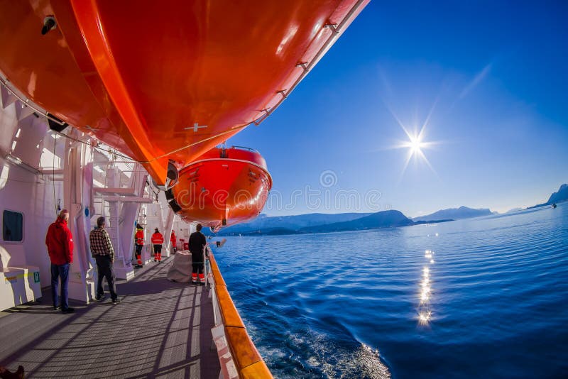ALESUND, NORWAY - APRIL 04, 2018: Outdoor view of life boats on board of the MS Trollfjord, operated by the Norwegian. Shipping company Hurtigruten in Norway royalty free stock photo