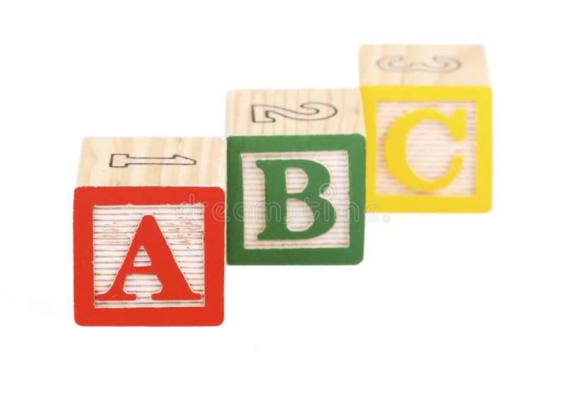 Alphabet blocks isolated. Alphabet blocks lined up to spell abc - isolated on white - focus on A block stock images