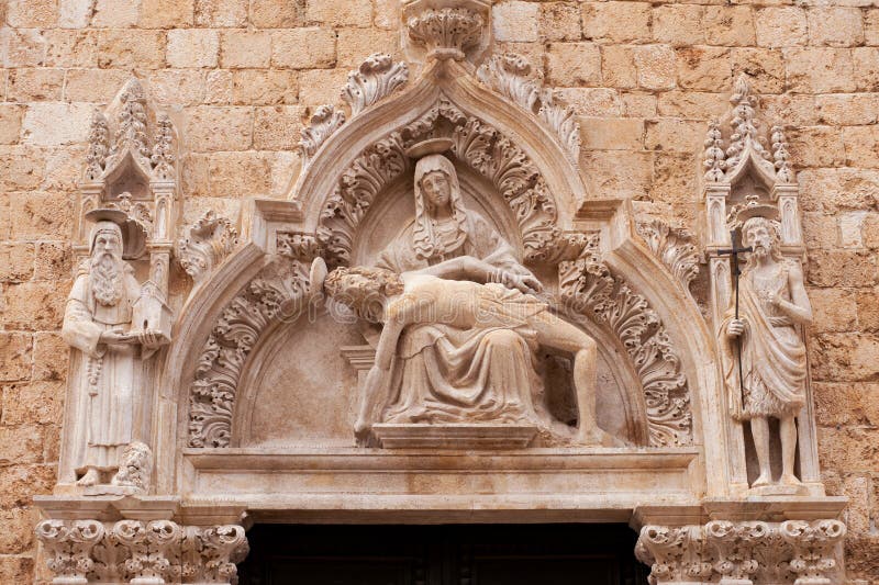 The arch above the entrance in catholic temple. In Dubrovnik, Croatia royalty free stock photo