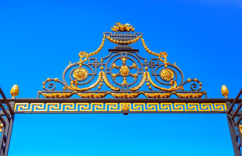 The arch decorating the Central gate of the Summer garden in St. Petersburg. Arch that adorns the front gate of the Summer garden in Saint Petersburg royalty free stock photos