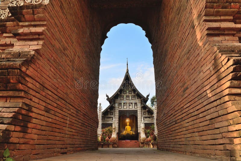 Beautiful temple in Thailand. Looking under Architech brick wall royalty free stock image