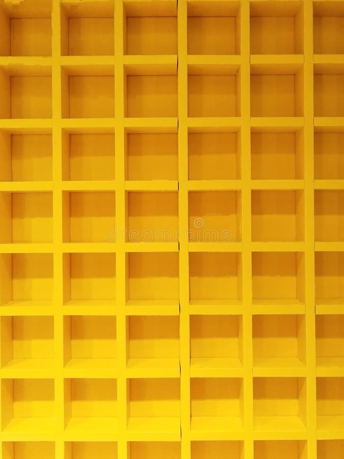 Beauty yellow square same pattern wooden block box shelves. interier decoration design in building house. no people. multi lines c. Ombine matrix buiding space stock photo
