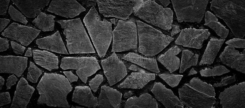 Black stone dark texture decoration on wall patterns background royalty free stock image