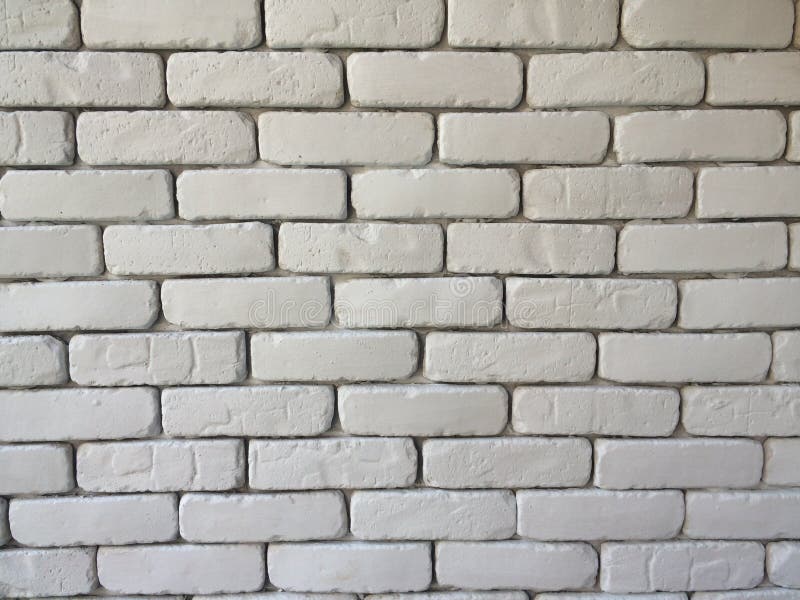 Brick block wall background in living room at home, white wall in house , restaurant or cafe, white big brick block wall wallpaper. In cafe on horizontal side royalty free stock images