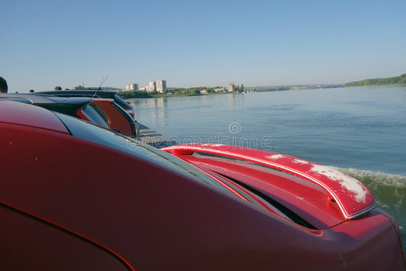 Cars on the ferry crossing the Danube River. Cars lined up on the ferry crossing the Danube River stock images