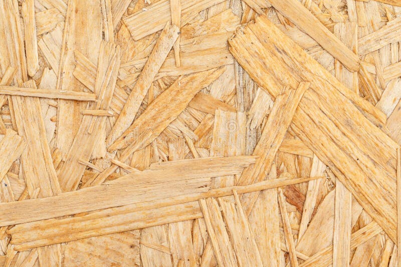 Chipboard. Close up pressed wooden panel background. Chipboard. Close up pressed wooden panel background, OSB wood royalty free stock photos