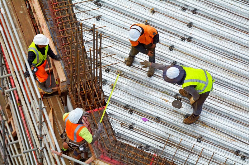Civil engineer supervise roof construction workers work stock image