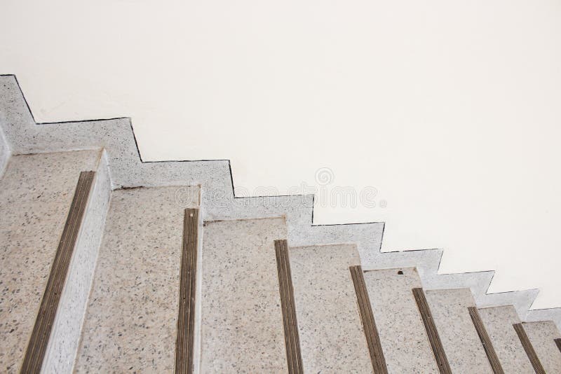 Close up Stairs terrazzo,marble floor in sideways of a wall.  royalty free stock photo
