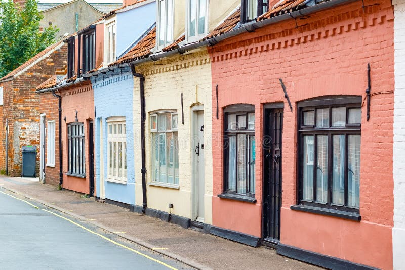 Colourful English brick cottages in the popular seaside town Southwold of the UK. Row of colourful English brick cottages in the popular seaside town Southwold stock photography