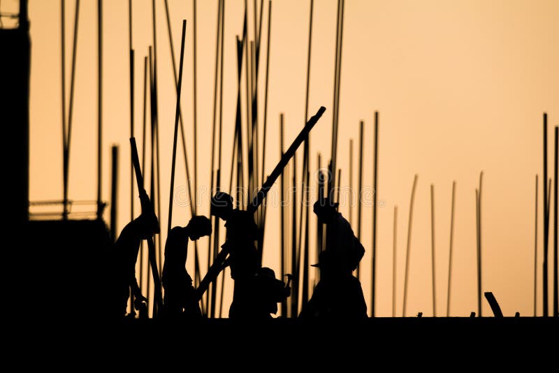 Construction worker silhouette on the work stock photography