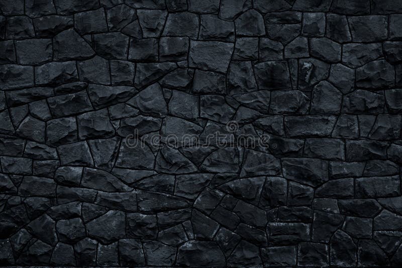 Dark stone background. Black rock wall texture. Abstract pattern. Natural backdrop. Decoration gray tiles at the facade of the bui. Lding. Marble geometric stock photography