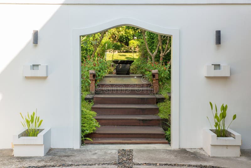 Decorative arched gateway to a garden.  stock photo
