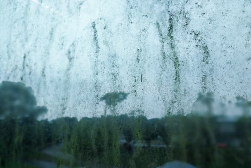 Dirty unhygienic mold stain on glass window because dampness stock images