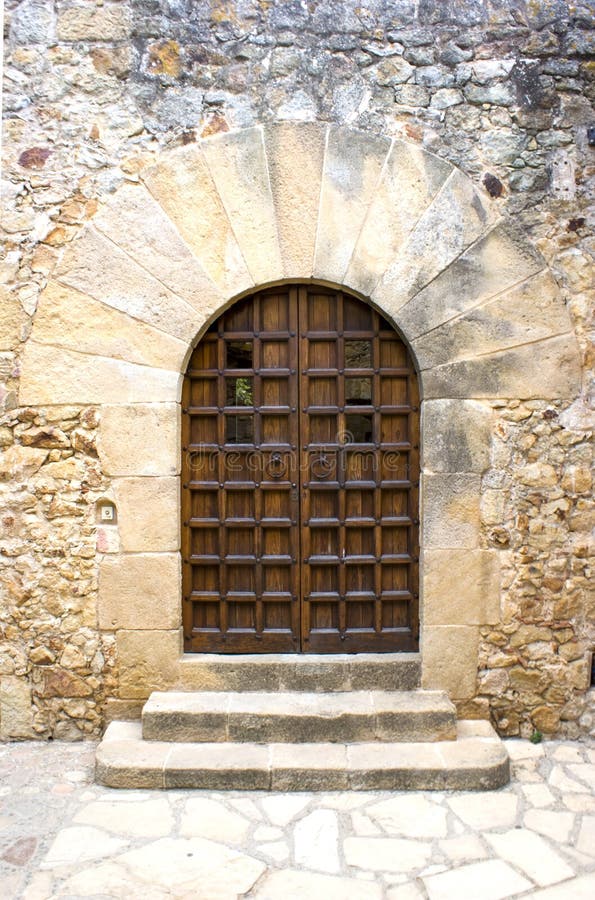 Doorway and arch in Pals. Girona stock photo