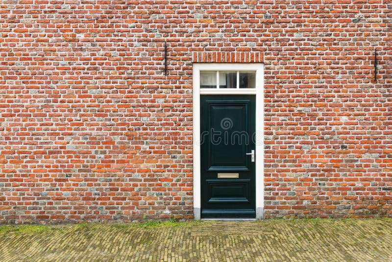 Dutch front door. In orange brick facade stock images