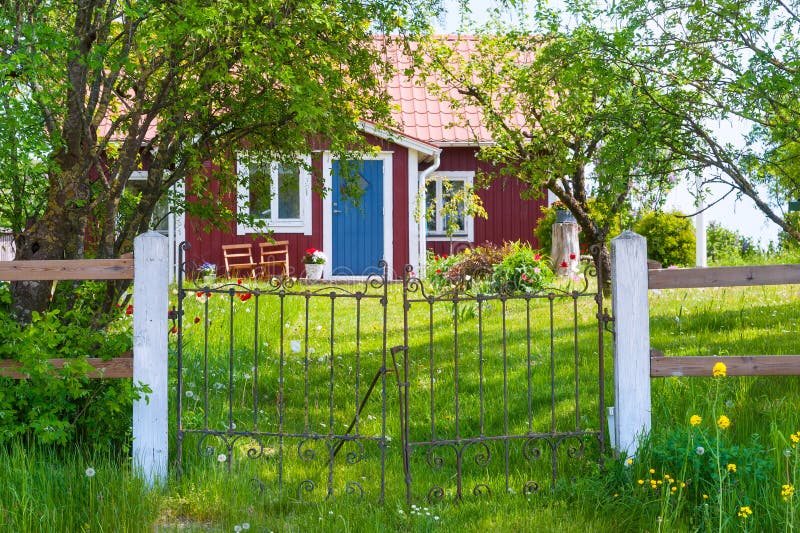 Entrance of red wooden cottage in Sweden stock image