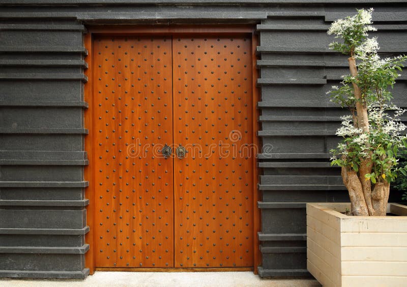 Modern architectural entrance wooden doors royalty free stock photography