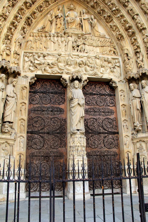 Exquisite detail in carvings in arched doorways,Notre Dame Cathedral,Paris,2016. Breathtaking detail in intricate carvings of stone doorways, Notre Dame stock photo Exquisite detail in carvings in arched doorways,Notre Dame Cathedral,Paris,2016. Breathtaking detail in intricate carvings of stone doorways, Notre Dame stock photo