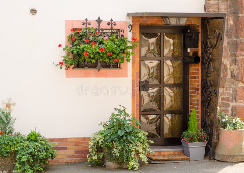 Front door. With flowers in the yard royalty free stock photography