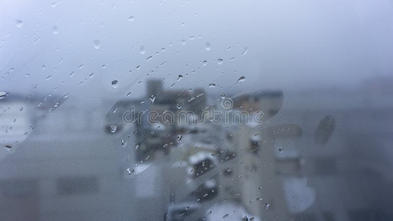 Hand draw and drops of water on window glass. stock photo