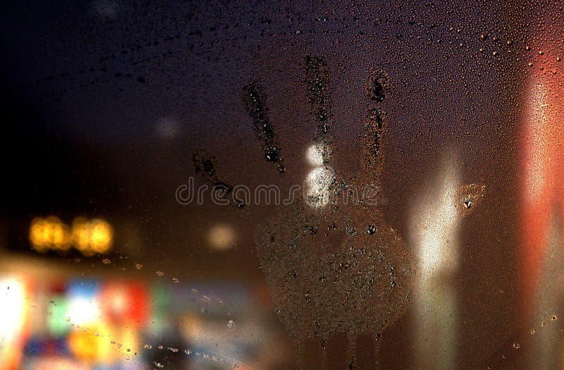 Hand Print on a Moisture Covered Window royalty free stock photography