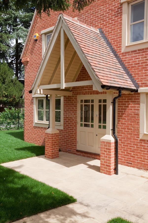 House Canopy. Contemporary home with large pitched roof canopy above the door stock photography