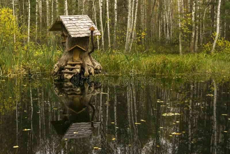 House of fabulous creatures in the swamp. Rerm, Russia - Octoder 02, 2018: art object - house of fairy creatures in stump on the swamp royalty free stock images