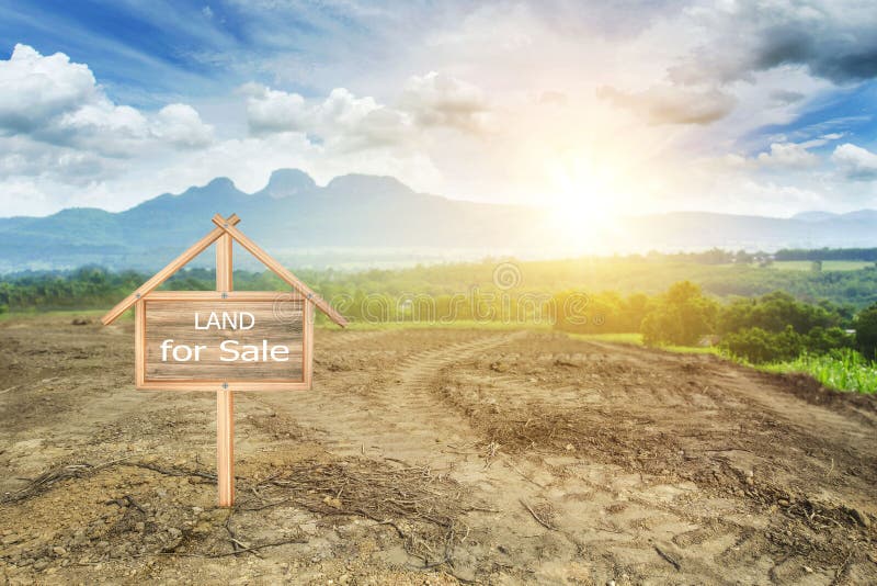 House symbol with location pin and Empty dry cracked swamp reclamation soil. Land plot for housing construction project with and beautiful blue sky with fresh stock images