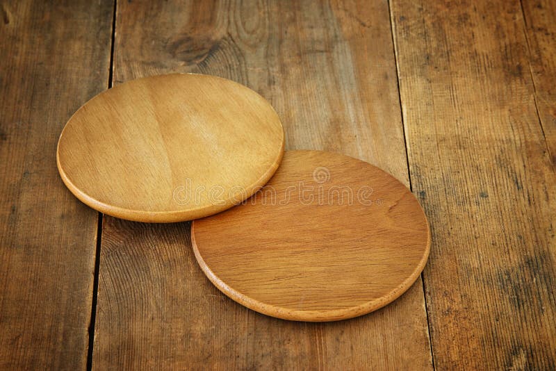 Image of wooden beer coasters on textured table background stock photos