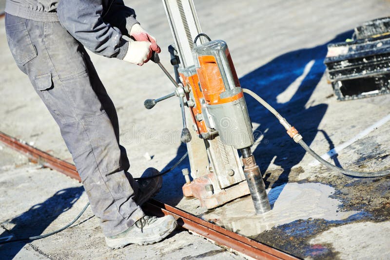 Industrial concrete drilling at construction demolition work royalty free stock images