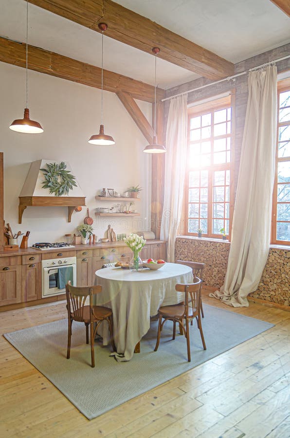 The interior of the kitchen in a rustic style, Scandinavian style. Wooden facades of cabinets. Nice sunny morning royalty free stock images