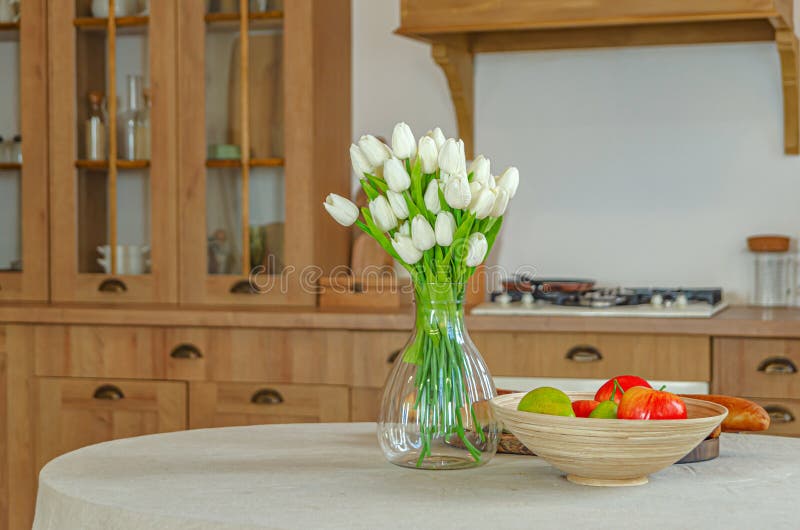 The interior of the kitchen in a rustic style, Scandinavian style. Wooden facades of cabinets. Nice sunny morning stock photos