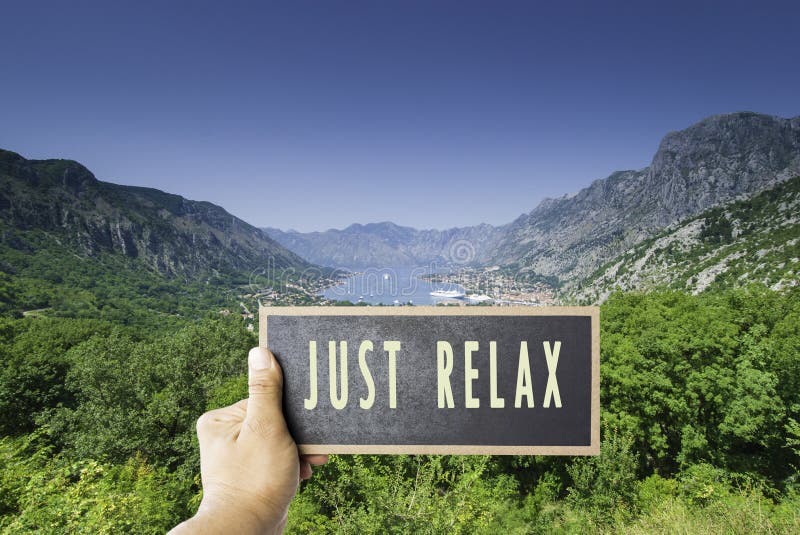 Just sit back relax and enjoy life sign on board mock up copy space overwrite view on summer bay sea ocean ships vacation between. Mountains bay no worries royalty free stock photo