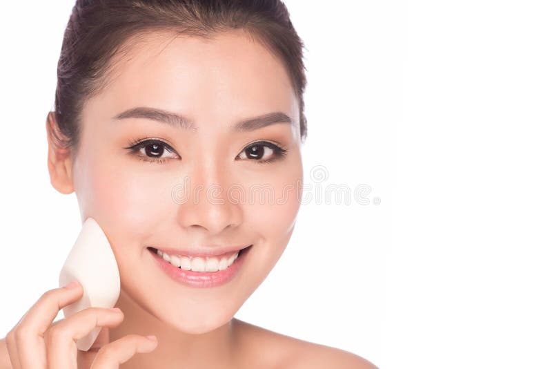 Makeup beauty Asian woman applying foundation face royalty free stock photography