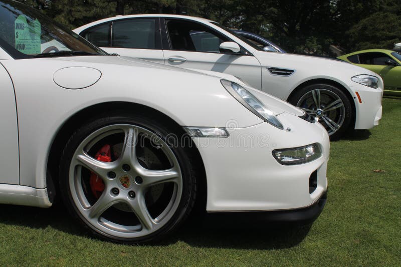Modern german sports car front detail. Front side details. modern white Porsche 911 Carrera sports car. Belle Macchine d