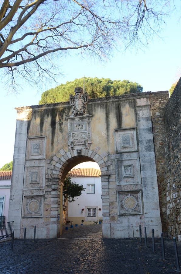 Old Arch. A view of an old stone archway which leads uphill to the castle in Lisbon stock photo