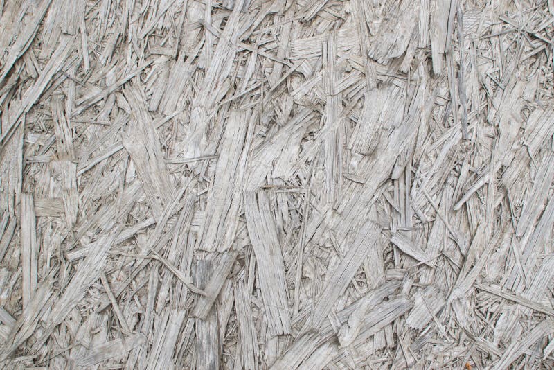 Old Grey Chipboard Osb Panel Texture. Old grey chipboard background top view. Aged osb panel texture or pressed and glued wood chips backdrop royalty free stock photo