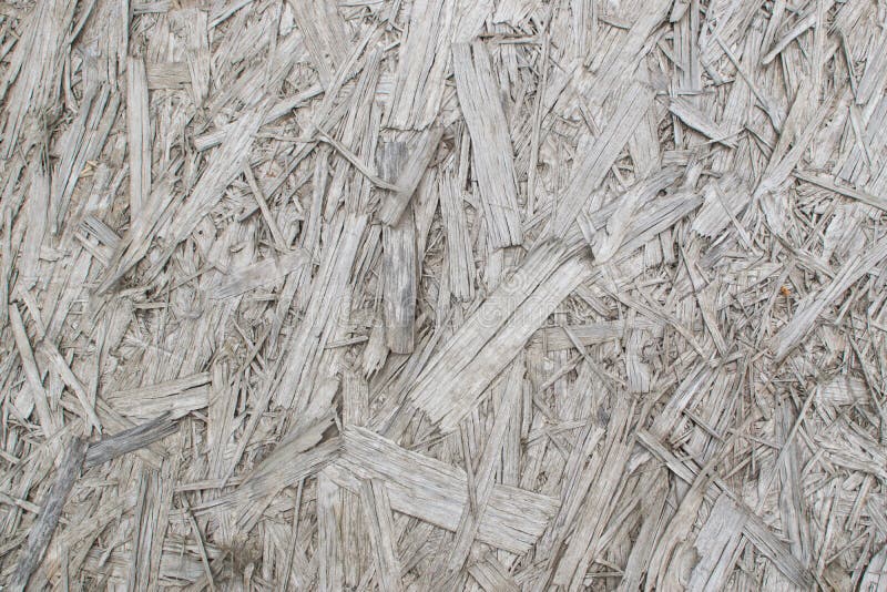Old Grey Chipboard Osb Panel Texture. Old grey chipboard background top view. Aged osb panel texture or pressed and glued wood chips backdrop stock photos