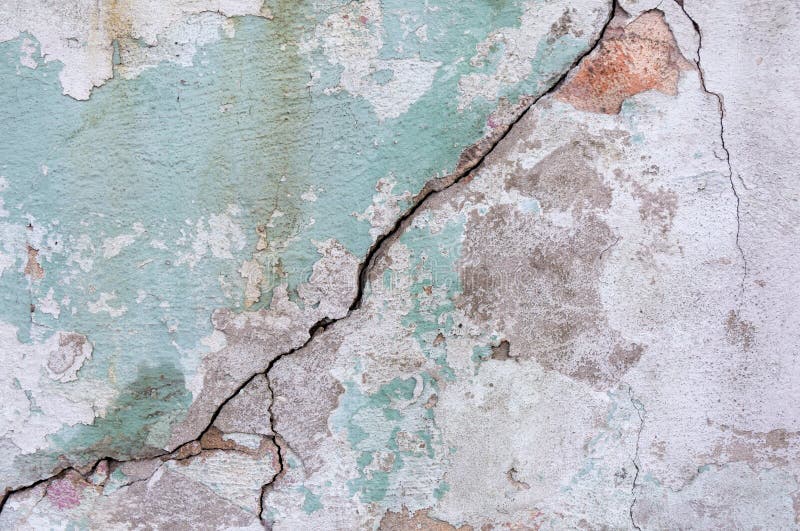 Old painted wall. Green and pink damage surface. Peeling paint background. Stone demaged backdrop. royalty free stock photos