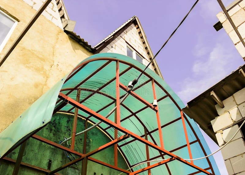 Polycarbonate canopy on the porch of the house. Pict