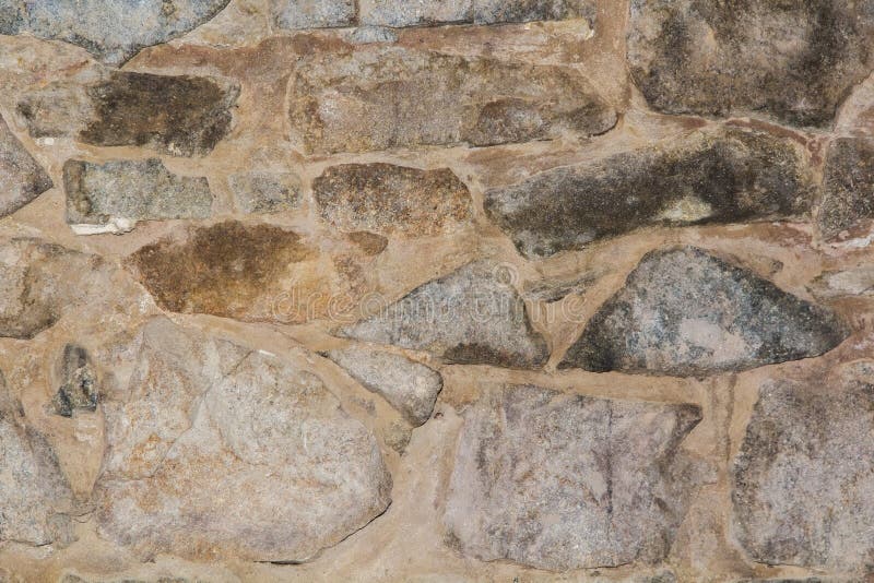 Plinth of stone close-up. Plinth of gray and yellow decorative stone, close-up stock image