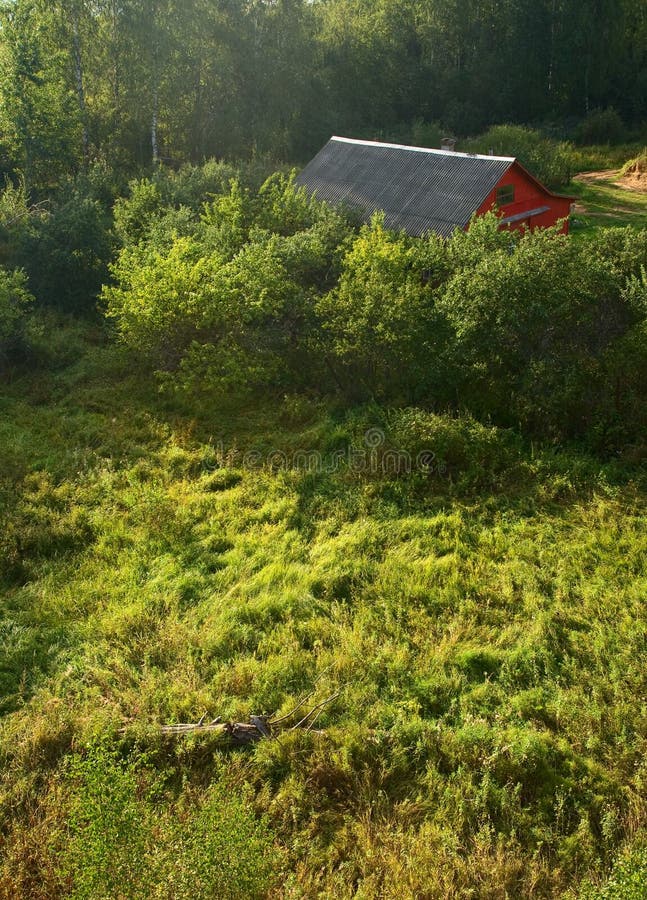 Red house on swamp. Rural landscape. Red house on swamp (view from above stock image