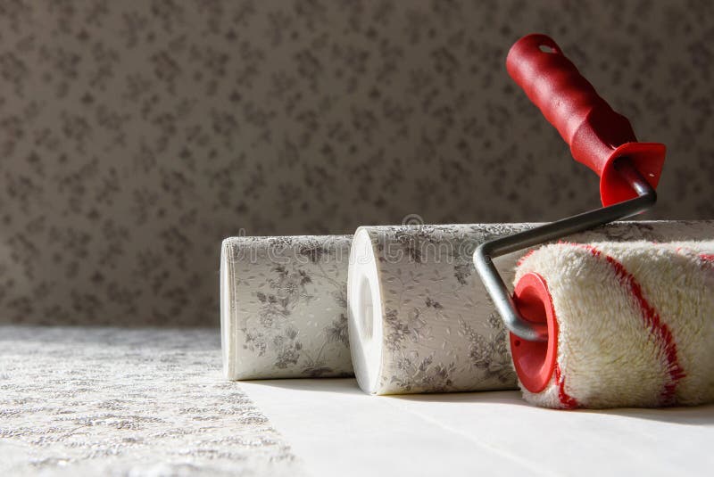 Rolls of wallpaper and roller. Preparation for repair in the apartment royalty free stock photos
