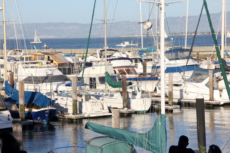 San Francisco Bay Pier 39 with ships and boats,. Important tourist destination with board watch, seal watching and view of Alcatraz Island royalty free stock images