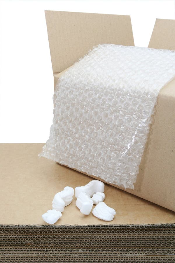 Shipping Stuff. ~ cardboard cartons, bubble wrap, and styrofoam shipping peanuts, isolated on white stock photography