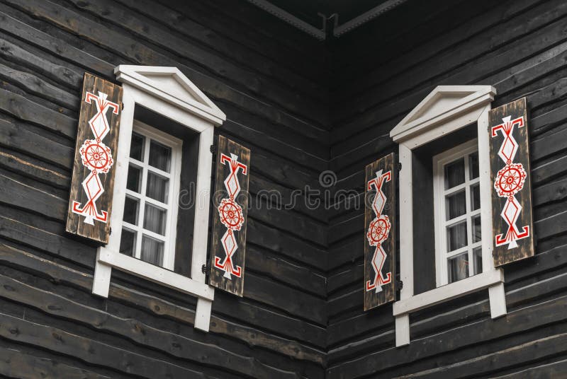 Modern windows with platbands in the traditional style royalty free stock photo
