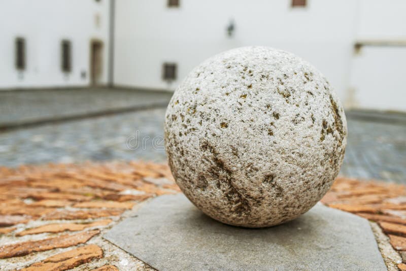 Stone ball in Mantua, Lombardy (Italy). Stone ball on a pedestal in Mantua, Lombardy (Italy). Mantua (Mantova) is a city and comune in Lombardy, Italy, and royalty free stock photo